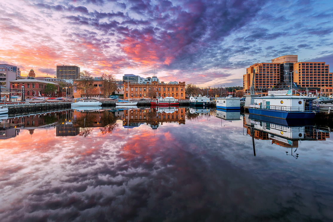 Calm, mirror finish water of Hobart’s Harbour.