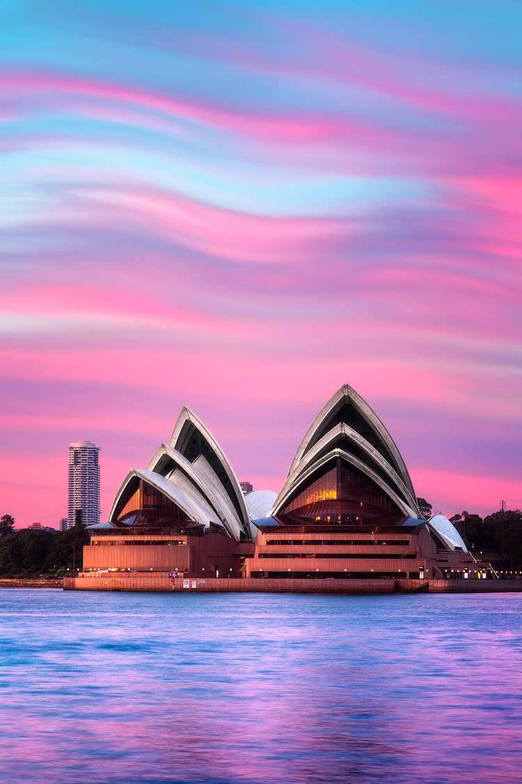 Sails of Sydney Opera House and pink waves in the sky